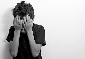 boy praying in poverty on the floor stock image with no help crying alone and all by himself on...