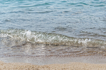 Splashing waves on a beach - 697834811
