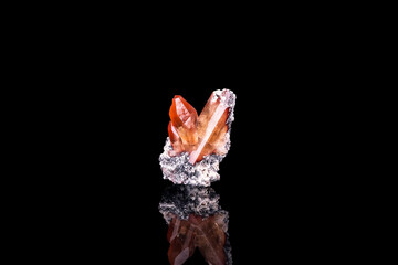 imperial topaz photography. crystal isolated on black background. macro detail close-up rough raw...