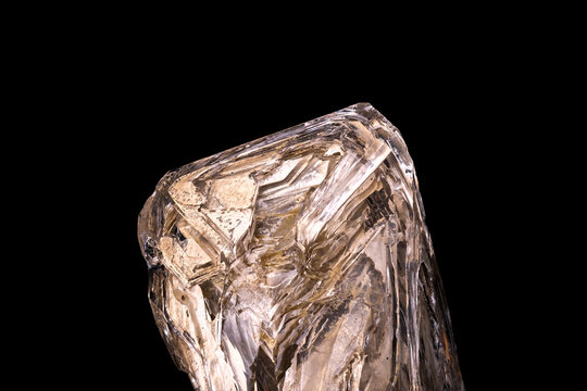 fenster elestial window quartz  (clay inclusion) photography isolated  on black background. macro detail close-up rough raw unpolished semi-precious gemstone.

