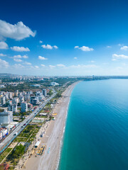 Awesome view of Konyaalti Beach and Park in Antalya, Turkey. Drone flying over the beach. Konyaalti Beach is a popular tourist attraction in Turkey.