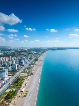 Awesome view of Konyaalti Beach and Park in Antalya, Turkey. Drone flying over the beach. Konyaalti Beach is a popular tourist attraction in Turkey.
