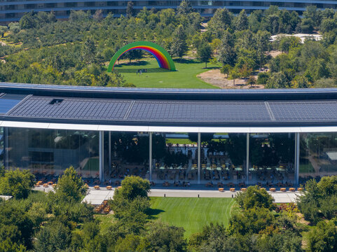 Aerial view of the main Apple office building - a space ship in California, USA. - Powered by Adobe