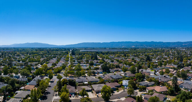 Aerial view of the main Apple office building - a space ship in California, USA. - Powered by Adobe