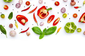 Various fresh vegetables and herbs on white background.