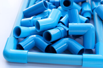 Blue pvc pipe connections for plumbing work. Plumber equipment