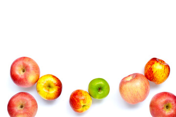 Variety of fresh apples on white background.