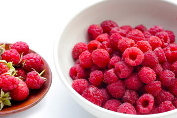 Fresh raspberry on white background.