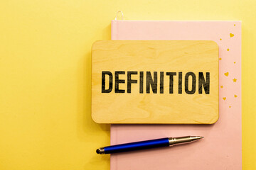 Definition word written on wood block. Definition text on wooden table for your desing, concept.