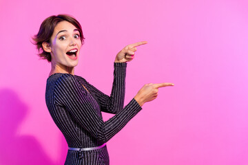 Photo of impressed cheerful lady wear glamour outfit pointing two fingers empty space isolated...