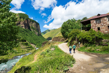 Summer hiking landscape in Georgia, Caucasus. Popular mountain hiking areas in Kazbegi, Truso Gorge area. - obrazy, fototapety, plakaty