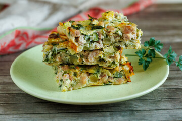 Zucchini chicken casserole. Dietary, low-calorie fitness food. Home Casserole from courgettes with chicken and cheese, homemade food