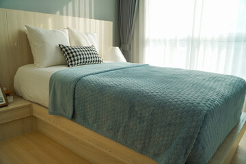 comfortable pillow on bed decoration in bedroom interior with light from window,Natural light....