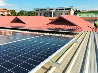 Installation of solar panels on the roof To help save on electricity bills within homes and office...