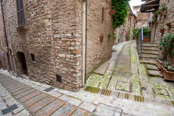 Fototapeta na wymiar Cobblestone Pedestrian Alley in Spello - Italy