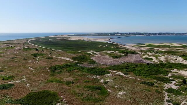 Aerial view of Cape Cod Provincetown beaches and lighthouses, multiple clips