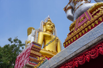 God buddha buddhishm statue buddhist lord next to the temple