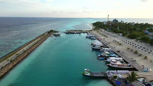 Aerial view over Dhangethi Bridge Harbour including fishing and dive boats, Maldives, Indian Ocean.
