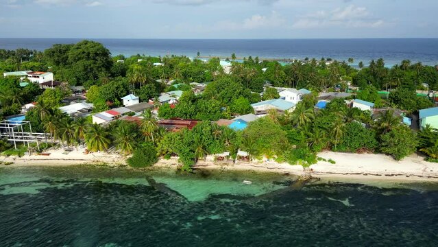 Aerial view of Dhangethi town, beach and reef. Maldives, Indian Ocean.