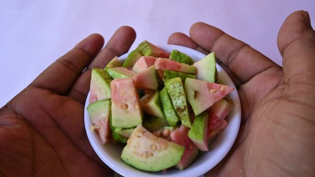 Slices of Guava. It is &nbsp;is a common&nbsp;tropical fruit. Its other names common guava, Psidium guajava, lemon guava, apple guava. This is is a small tree in the myrtle&nbsp;family. Ripe Guava.