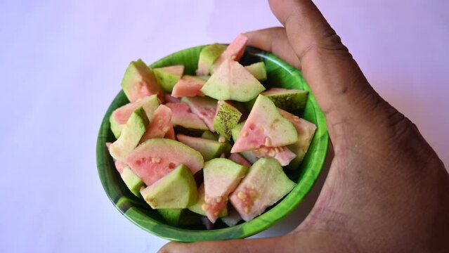 Slices of Guava. It is &nbsp;is a common&nbsp;tropical fruit. Its other names common guava, Psidium guajava, lemon guava, apple guava. This is is a small tree in the myrtle&nbsp;family. Ripe Guava.
