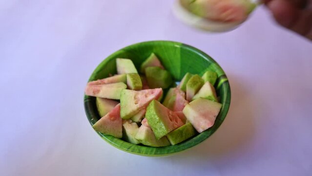 Slices of Guava. It is &nbsp;is a common&nbsp;tropical fruit. Its other names common guava, Psidium guajava, lemon guava, apple guava. This is is a small tree in the myrtle&nbsp;family. Ripe Guava.
