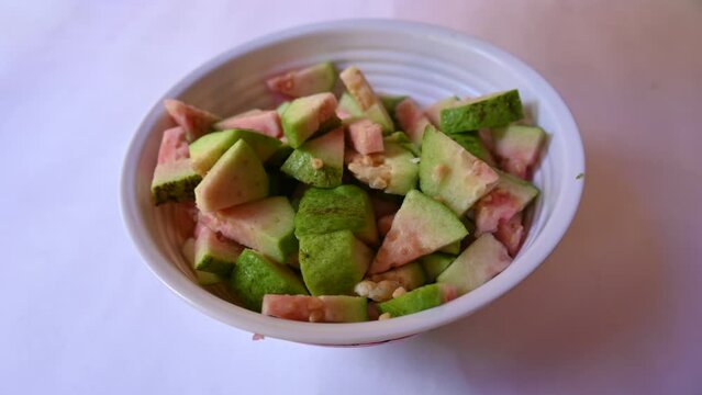 Slices of Guava. It is &nbsp;is a common&nbsp;tropical fruit. Its other names common guava, Psidium guajava, lemon guava, apple guava. This is is a small tree in the myrtle&nbsp;family. Ripe Guava.

