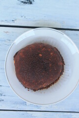 Round shape torn bread with abon topping in a plate on the table