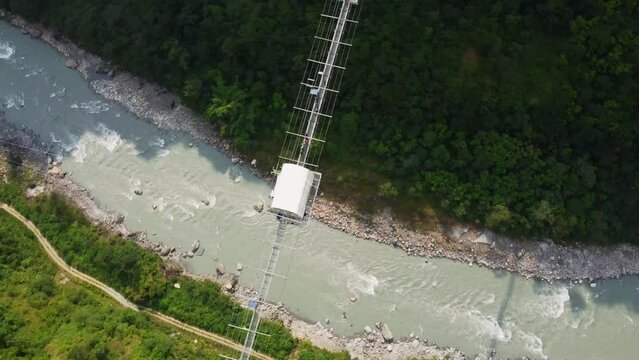 Spectacular aerial high above Kushma suspension bridge bungee jump 