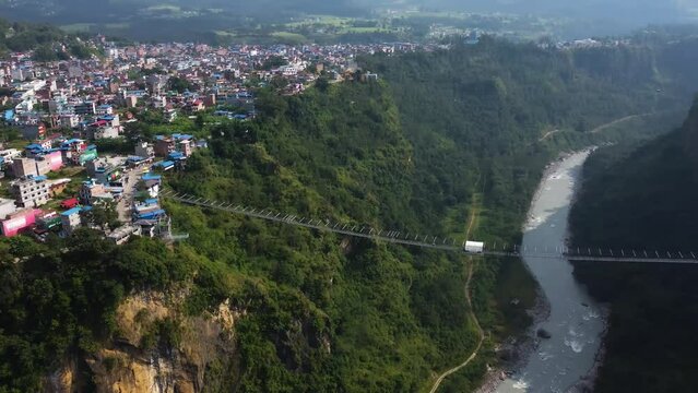 Nepal Kushma bungee jump off suspension bridge, Panning Shot 