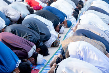 Many Muslims, children, women, and men pray and celebrate Eid al-Fitr, Eid mubarak  which marks the...