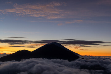 Fototapeta na wymiar Sunrise over Mount Agung seen from Mount Batur, Bali, Indonesia