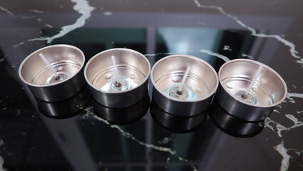Tealight holder The image you’ve shared appears to be a close-up shot of four cylindrical...