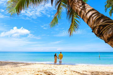 Tropical Island Koh Kood or Koh Kut Thailand. Couple men and women on vacation in Thailand walking at the beach