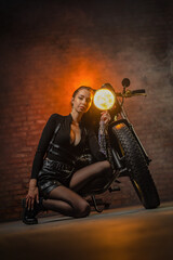 Plakat Young beautiful girl with dark hair on the old motorbike. Girl motorbiker.