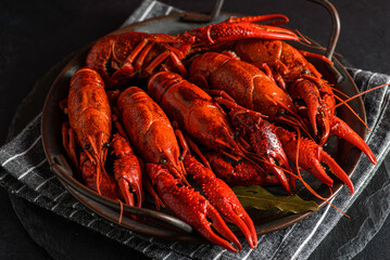 boiled crayfish on a black plate