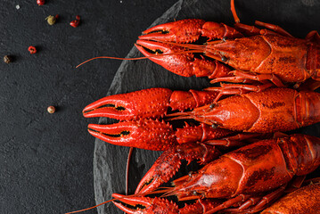 boiled crayfish on a black plate