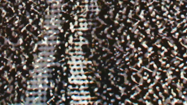 Close-up of retro LCD CRT screen during a glitch overlay pattern