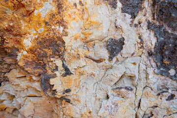 Weathered stone background. Brown rock surface texture.
