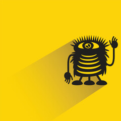 funny monster character with shadow on yellow background