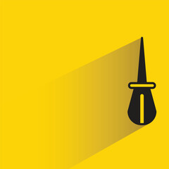 screwdriver with shadow on yellow background