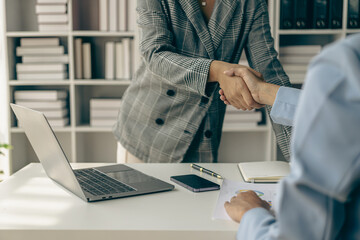 Thank you for letting me be part of the team. Cropped view of two businessmen shaking hands during meeting for success in job interview in business office Thank you partner, close-up photo - Powered by Adobe