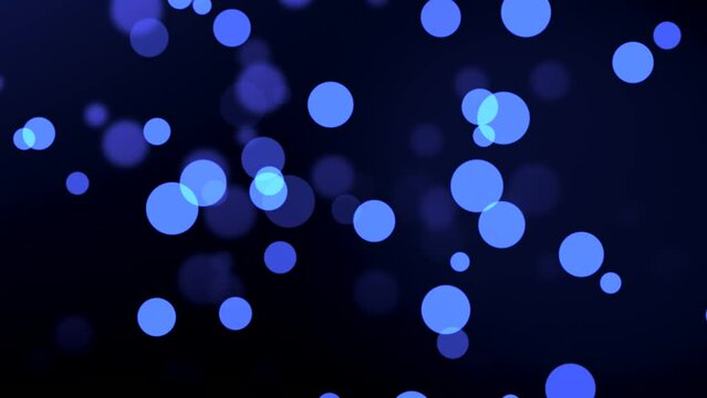 Animation of blue particle circles moving on bokeh background