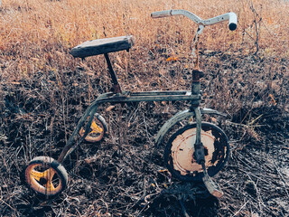Old tricycle on the ground