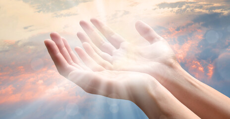 The outstretched hands of a praying man - obrazy, fototapety, plakaty