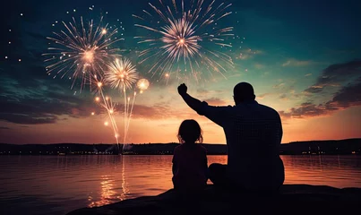 Foto op Canvas Father and Daughter Enjoying Spectacular Fireworks Reflections on the Water © uhdenis