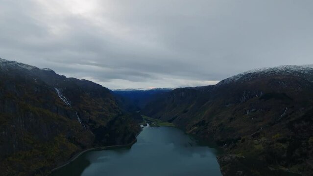 aerial cinematic view over Sandvevatn lake in norwegian mountains druing morning