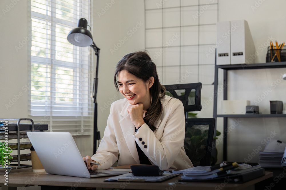 Poster businesswoman smiling confident using laptop computer working on financial statistics with graph doc