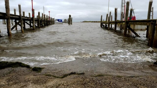 Small waves hitting the harbor of Rantum, Sylt.