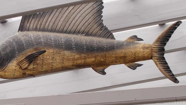 Panshot over fake fish made out of plastic. Realistic model of a big fish.